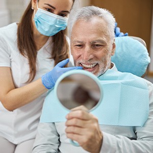 An aging gentleman happy with his new dental implant